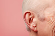 closeup image of an older adult's ear sheds light on the issue of hearing loss, a common problem that affects the health and well-being of many individuals as they age.