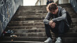 © Trendy Graphics - Depressed young teenager boy suffering From depression sitting on stairs