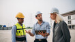© NewSaetiew - Engineer talks with the team to plan the factory setup. Professionals working planning and talking to design the arrangement of warehouse.