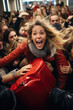 A crowd of women jostle to grab discounted clothes in a shopping center. Black Friday Sale.