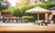 Empty wooden table top in front, blurred barbecue zone background. Horizontal blank bar counter with empty space for product. Table mockup, generated by AI