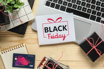 Sticker - Black Friday sale greeting card with laptop, gift boxes and credit card on wooden table