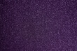 Fondo de brillos / textura glitter de color violeta/morado. Se puede usar como fondo de celebración, año nuevo o navidad.