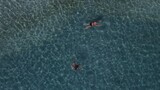 Fototapeta Nowy Jork - Aerial drone view parga greece, beach crowded with tourists in vacation on summer in famous greek caribbean parga town epirus preveza