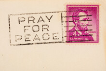 Pray For Peace Postmark Cancellation Stamp On An Aged Postcard With Copy Space
