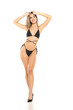 © vladimirfloyd - Pretty young smiling woman posing in black swimsuit on white background. Front view.