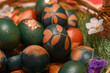 © Vanja Stokic - A basket full of eggs, painted blue. Coloring eggs for the Orthodox Easter holiday. Decorating eggs with plants.