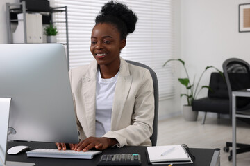 Poster - Professional accountant working on computer at desk in office. Space for text