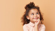 © Shanorsila - Close up potrail of cute little girl looking above. Concept of curious ,imiginative, new idea, solution from young and smart kids. Pastel color background with copy space.