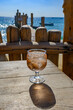 Summer time in Provence, glass of rose wine with ice cubes on bar terrace Pampelonne sandy beach near Saint-Tropez in sunny day, Var department, France