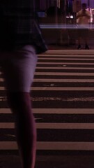 Wall Mural - vertical timelapse low angle view to the asphalt crossing street at intersection area in night time