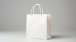© Shanorsila - Blank white paper shopping bag on white background.