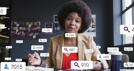 Wall Mural - Animation of social media data processing over biracial businesswoman on video call