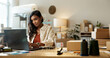 © N Felix/peopleimages.com - Woman, business and shipping on laptop in office for research, feedback and supply chain for ecommerce. Indian, person or planning on pc for logistics, stock administration or package distribution