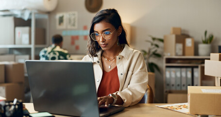 Poster - Business, woman or reading on laptop in office for research, feedback and supply chain for ecommerce. Indian, person or planning on pc for logistics, stock administration or package distribution data