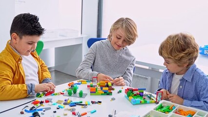Wall Mural - robotics programming class. children construct and code robot. stem education using constructor bloc