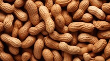 Cluster of peanuts reveals their textured shells and nutritious appeal