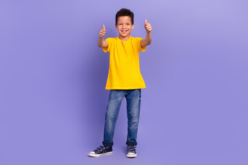 Wall Mural - Full length photo of nice young pupil boy showing double thumb up good quality dressed yellow garment isolated on violet color background