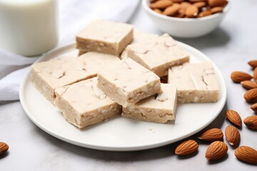 Poster - almond protein bars laid out on a square white plate