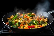 tofu and vegetable stir-fry dish with steam rising