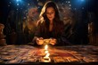 Fortune teller. Woman dealing tarot cards in dark salon with candlelight. Psychic reading esoteric session. 