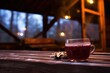a glass of mulled wine on a wooden bench in a steamy outdoor hot tub