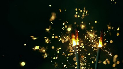 Wall Mural - Super slow motion of burning sparklers on black background. Filmed on high speed cinema camera, 1000fps.