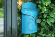 © jobi_pro - Sky Blue Postbox on Room's Glassed Outside Wall