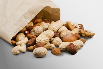 Canvas Print - Mix of tasty dry nuts and fruits on the desk