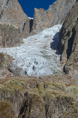 Wall Mural - One of the many glaciers of the Mont Blanc Alps in Val Ferret, near the town of Courmayeur, Aosta Valley, Italy - October 2, 2023.