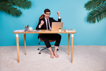 Sticker - Photo of excited crazy marketer man using netbook in office celebrate summer resort sale isolated blue shore color background