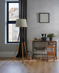 Wall Mural - Decorative room chair, table, laptop, vase of plant, lamp and frame in front of the grey wall, brown curtain, parquet interior design, working corner.