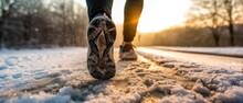 close-up foot and legs running sport, backlight winter