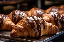 Chocolate croissants in bakery.