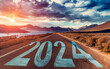 2024 New Year future vision concept. Nature landscape with highway road leading forward to happy new year celebration.