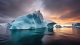 Fototapeta  - énorme iceberg à la dérive le soir sous un ciel orageux à l'heure dorée