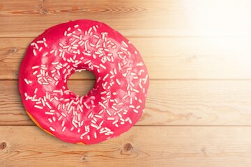 Wall Mural - Sweet tasty strawberry pink glazed donut