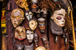 Traditional wooden Zanzibar masks expressing different emotions in the souvenir shop for sale, Stone Town, Tanzania. Tanzanian souvenirs at Zanzibar.