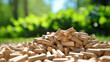 Organic wood pellets over green outdoor background.

