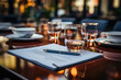 Elegant restaurant table setting with document and pen, highlighted by ambient evening bokeh lights.
