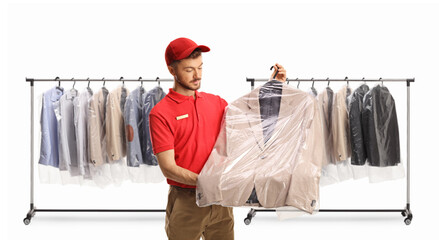 Sticker - Dry cleaning worker looking at spotless suit in a plastic bag cover