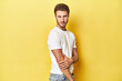 © Asier - Young Caucasian man posing on a vibrant yellow studio backdrop