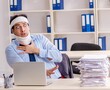 © Elnur - Young injured male employee working in the office