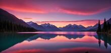A Vibrant Sunset Paints The Sky In Hues Of Pink, Orange, And Purple Over A Serene, Glass-like Lake Bordered By Tall, Majestic Mountains.