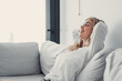 © Daniel - Young calm woman chilling relaxing leaning on comfortable sofa napping on couch in living room resting having healthy quiet nap, breathing fresh air, no stress free weekend at home, peace of mind.
