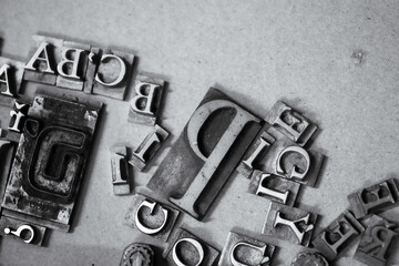 Antique printing press letters close-up metallic color