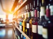 Abstract blur wine bottles on liquor alcohol shelves in supermarket store background.