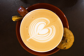 Wall Mural - A cup of coffee with milk foam and latte art