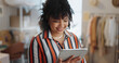 © Clement C/peopleimages.com - Businesswoman, happy and smile with tablet in office for customer review, feedback or success of delivery. African person, fashion designer and excited for growth in sales, retail and e commerce