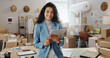 © Clement C/peopleimages.com - Portrait, boxes and woman with a tablet, ecommerce and smile with connection, internet and delivery with company website. Face, person or employee with technology, shipping or online order with sales
